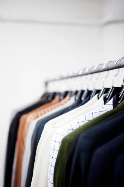 istock Men clothes hanging stacked on hanger 687832830