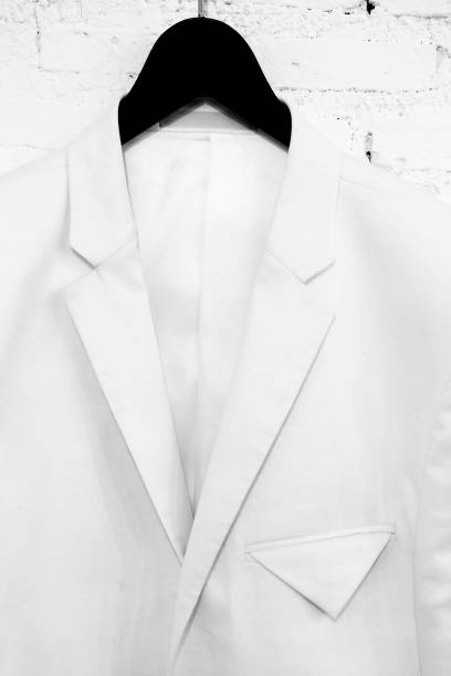 istock Suits hanging stacked on wall,close up 687832836