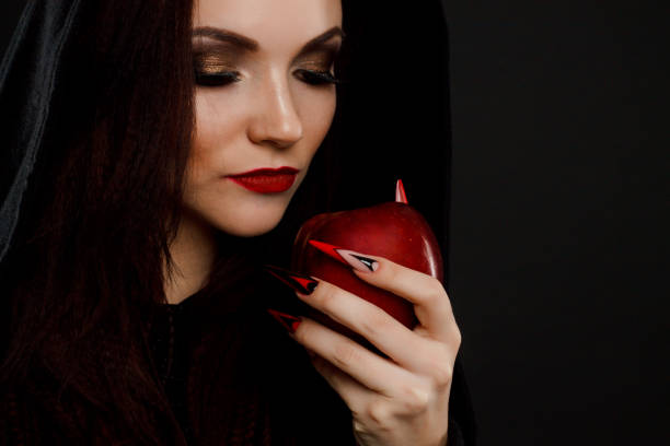 istock Stepmother witch gives poisoned red apple 687836956