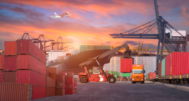 istock Logistics and transportation of Container Cargo ship and Cargo plane with working crane bridge in shipyard at sunrise, logistic import export and transport industry background 687843316