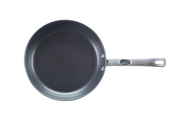 istock Top view of new empty frying pan isolated on white 687843442