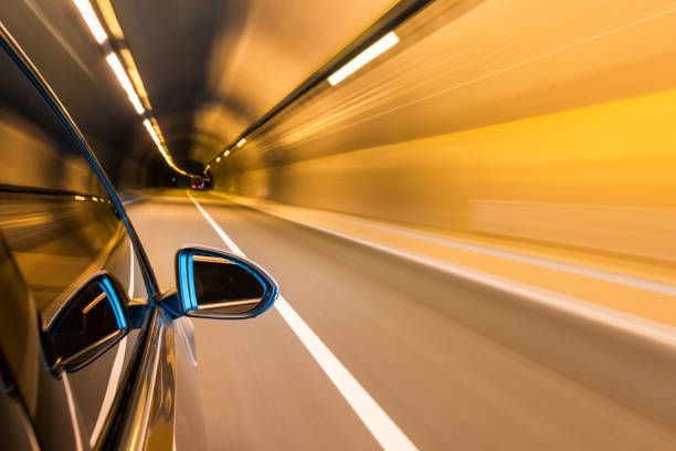 istock car driving with tunnel motion blur 687845936