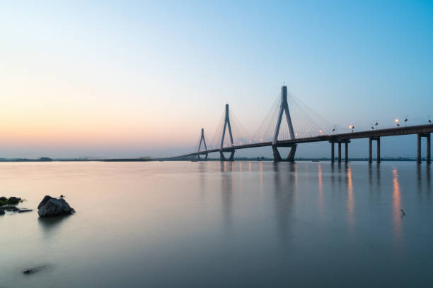 istock dongting lake bridge in sunset 687846048