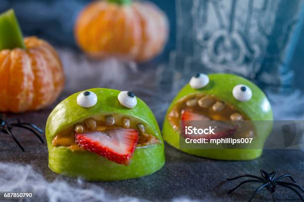 Healthy Halloween Apple Monsters Fruit Kids Treat Stock Photo - Download Image Now - Halloween, Snack, Food