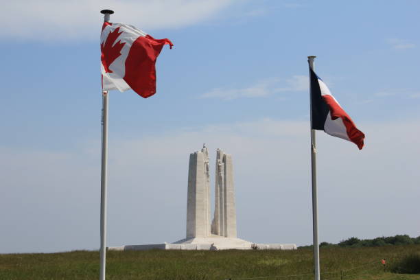 Canadian and French Flags at Vimy Ridge The Canadian and French Flags at Vimy Ridge War Memorial vimy memorial stock pictures, royalty-free photos & images