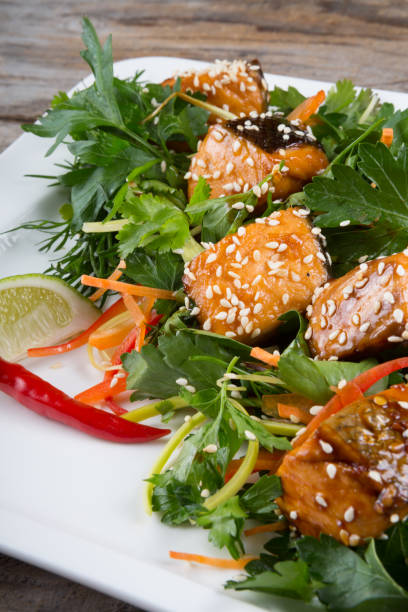 istock Salad with herbs and salmon 687868262