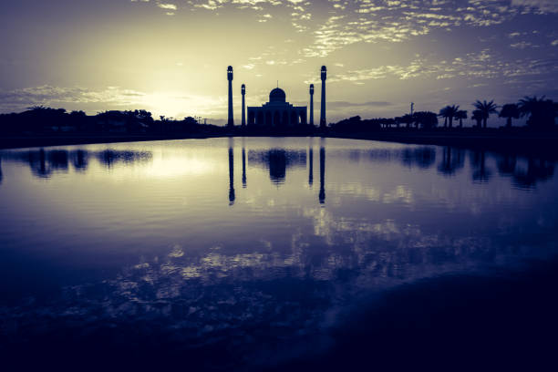 silhouette of mosque on sunset sky background