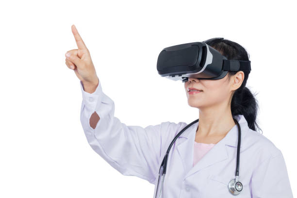 istock Asian female doctor touching screen by virtual reality goggles 687869778