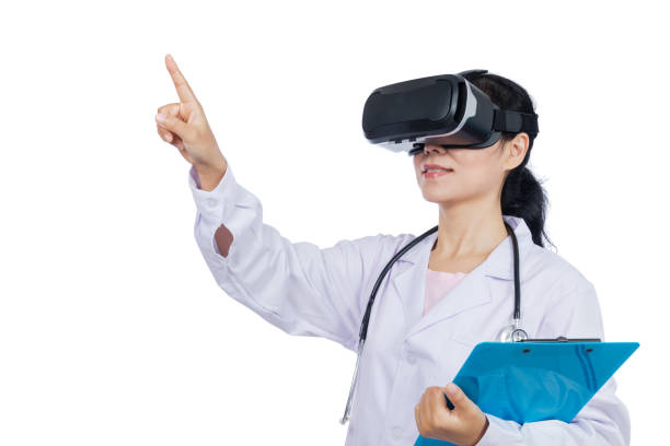 istock Asian female doctor touching screen by virtual reality goggles 687870516