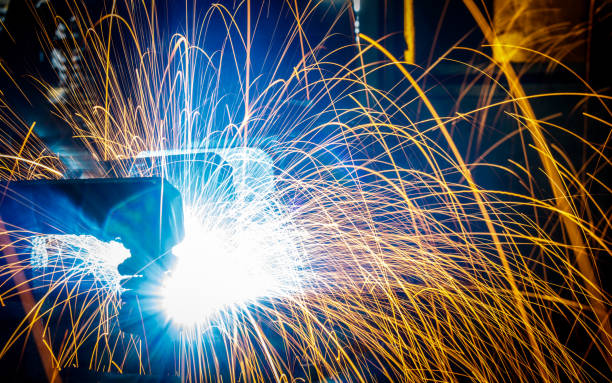 istock Welding robots movement in a car factory 687872084