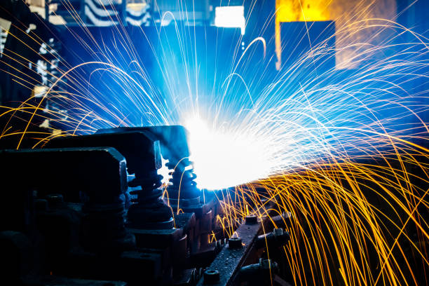 istock Welding robots movement in a car factory 687872674