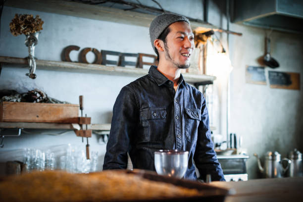 istock confident young male happy cafe owner 687875080