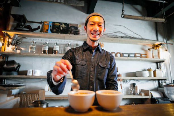 istock confident young male happy cafe owner 687875118