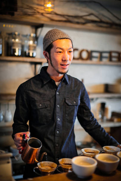 istock confident young male happy cafe owner 687875208