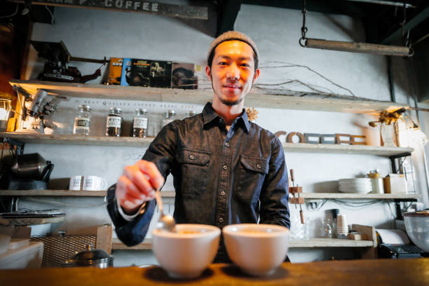 istock confident young male happy cafe owner 687875294
