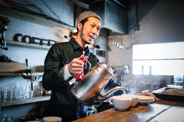 istock confident young male happy cafe owner 687875314