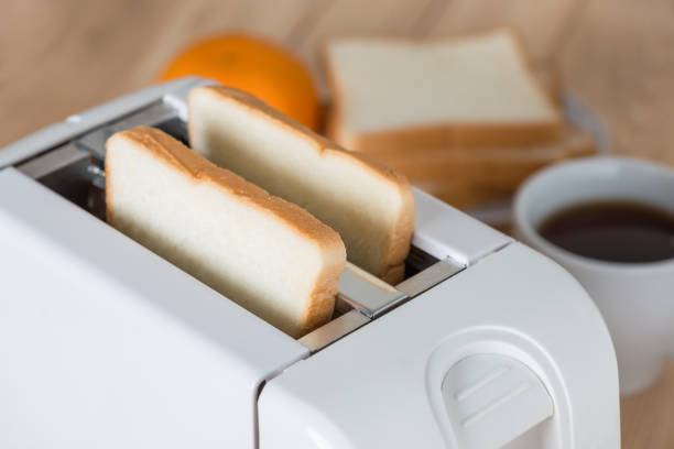 istock Close up, Bread in toaster with coffee. 687881188