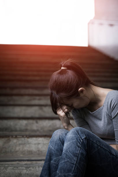 istock depressed woman in underground 687881750