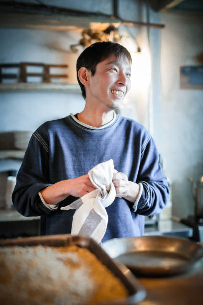 istock confident young male happy cafe owner 687884548