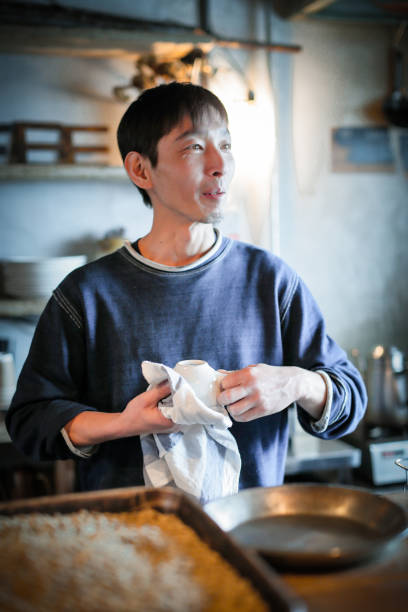 istock confident young male happy cafe owner 687884992