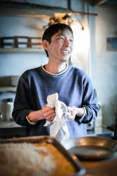 istock confident young male happy cafe owner 687885088