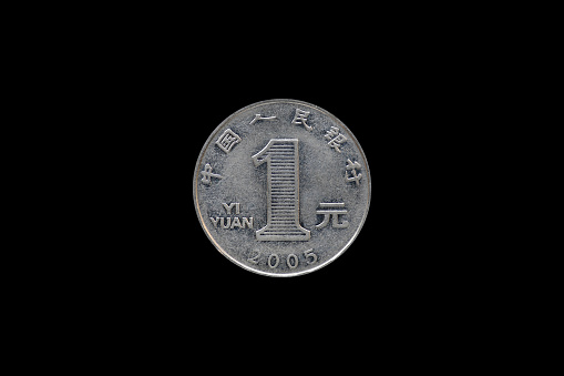 one Chinese jiao coin isolated on blackbackground.