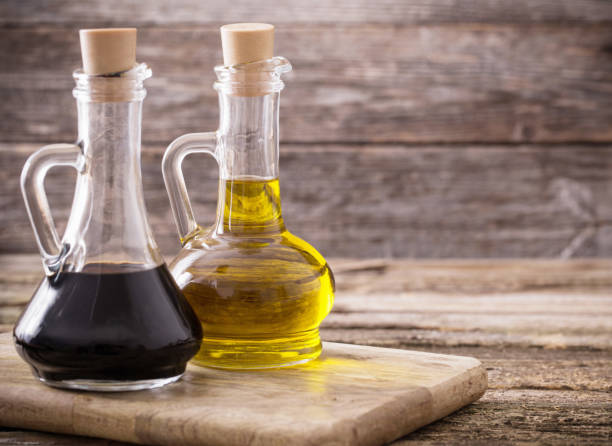 istock olive oil and balsamic vinegar on a wooden background 687885898