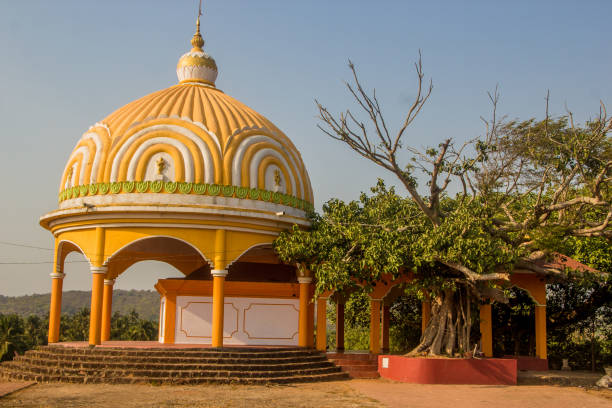 istock Temple in Goa, Arambol, India. Yellow small temple 687888974