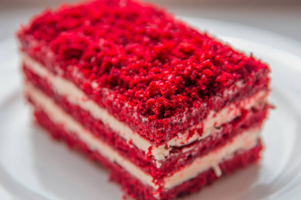 istock red velvet slice of cake on white plate 687889178