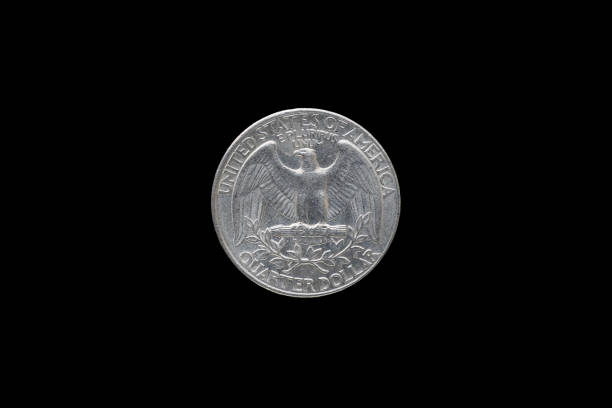 Twenty five American cents (Quarter Dollar) isolated on black background.