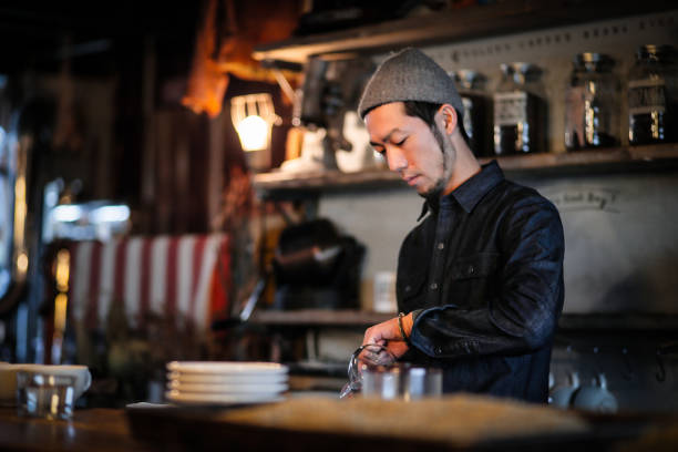 istock confident young male happy cafe owner 687889504