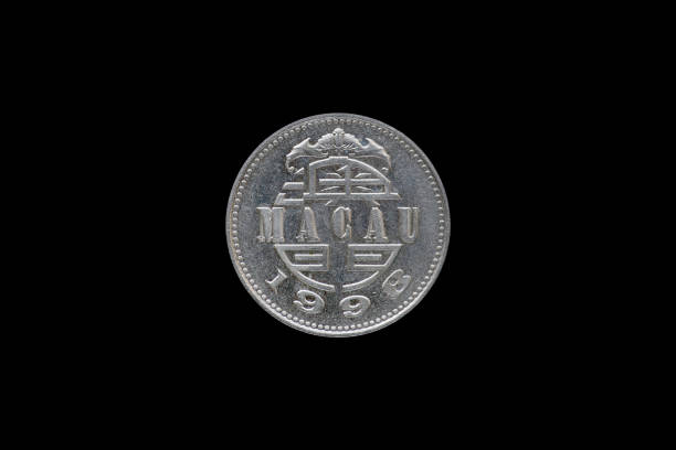 istock 1 PATACA Macanese coin year 1998 isolated on black background. 687889712