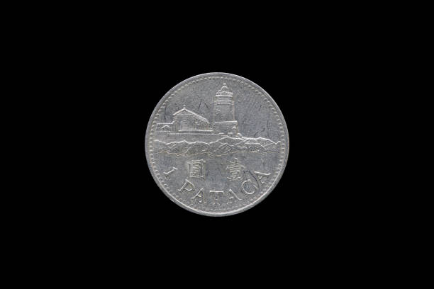 istock Macao 1 pataca coin isolated on black background. 687889778