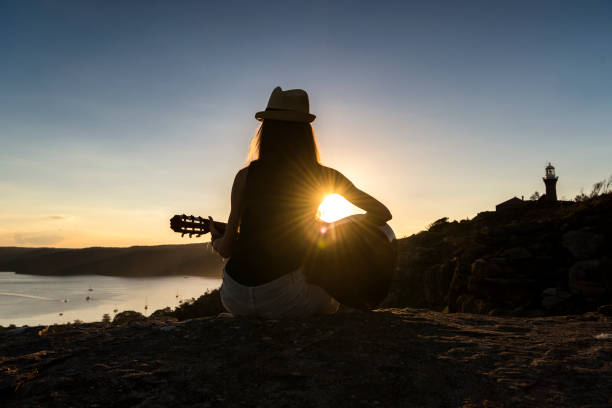 istock Guitar music at sunset 687892022