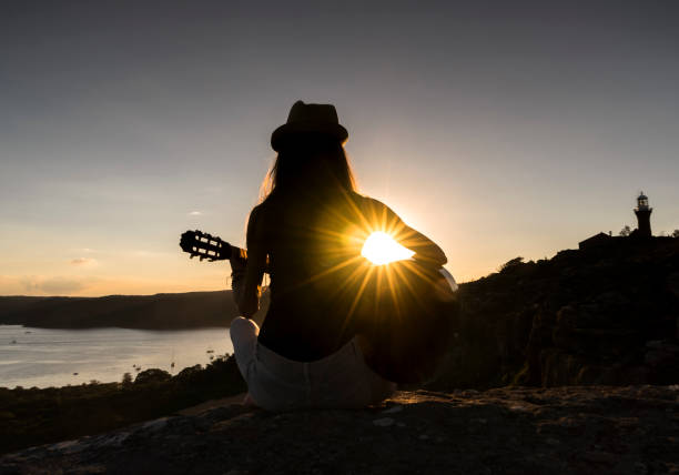 istock Guitar music at sunset 687892752