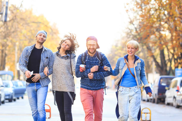 istock Friends walking on street and having fun 687892974