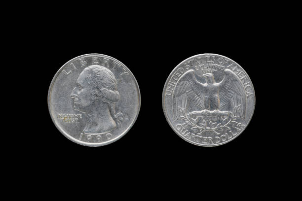 istock Twenty five American cents (Quarter Dollar) isolated on black background. 687893852