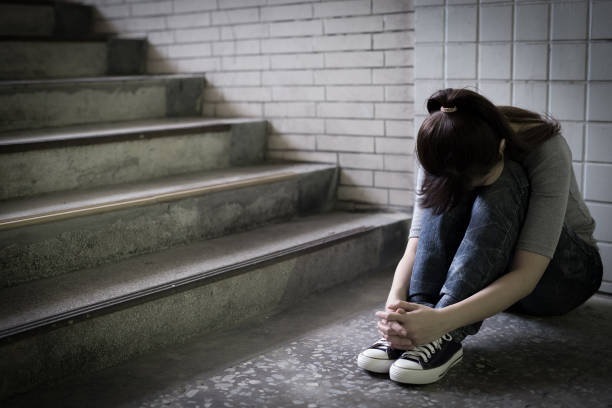 istock depressed woman in underground 687894180