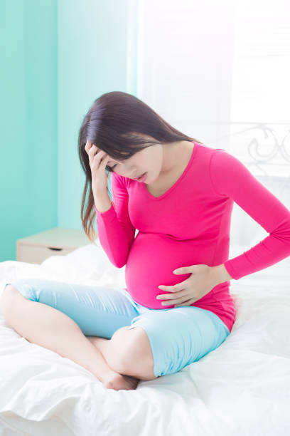 istock pregnancy woman feel pain 687897256