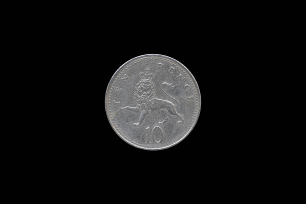 istock British Queen Elizabeth II 1992 Ten Pence Coin isolated on black background. 687898182
