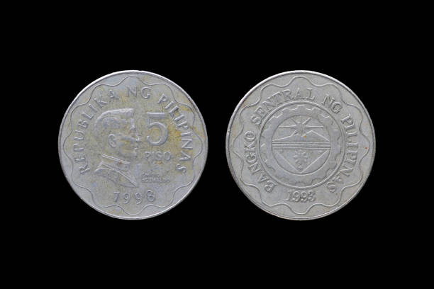 Philippine coins isolated on black background.