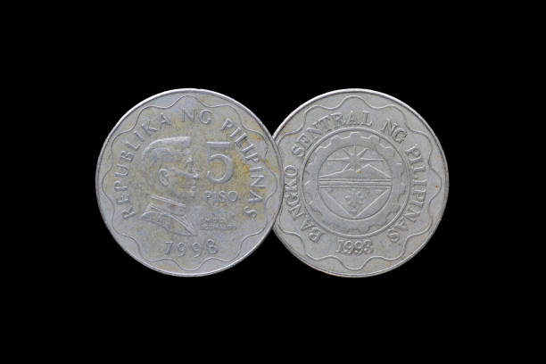 istock Philippine coins isolated on black background. 687898536
