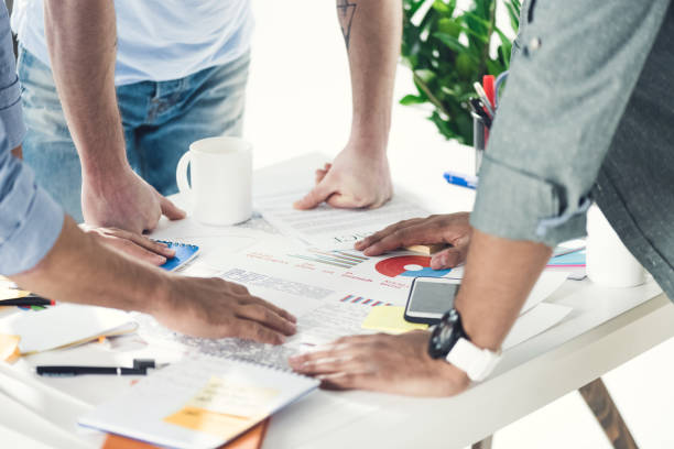 istock casual businessmen working on new project at modern office, business teamwork 687902010