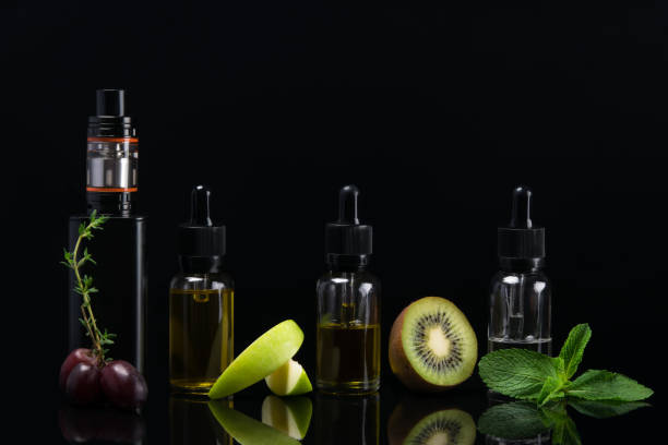 istock set of flavors for e cigarette on black background with reflection 687904864