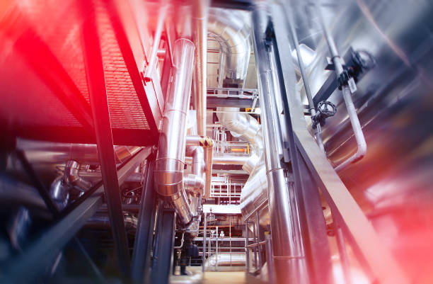 istock Industrial Factory. Various mechanisms and metal pipes. Toned image. Motion blur effect. 687905902