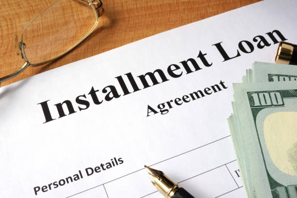 istock Installment loan form on a wooden table. 687909372