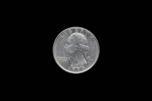 Twenty five American cents (Quarter Dollar) isolated on black background.