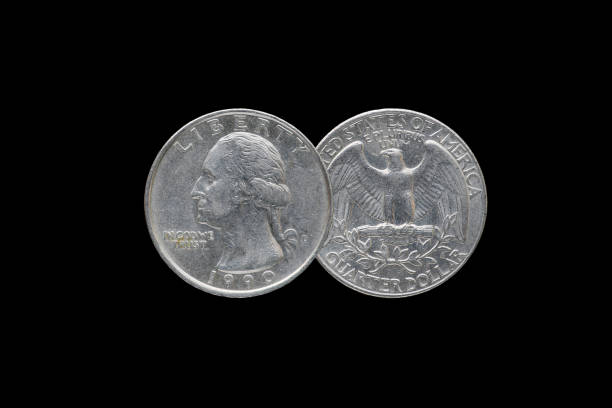 Twenty five American cents (Quarter Dollar) isolated on black background.
