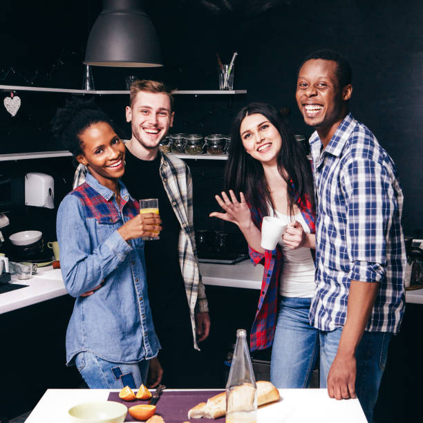 istock Happy friends at kitchen, two interracial couples 687916232