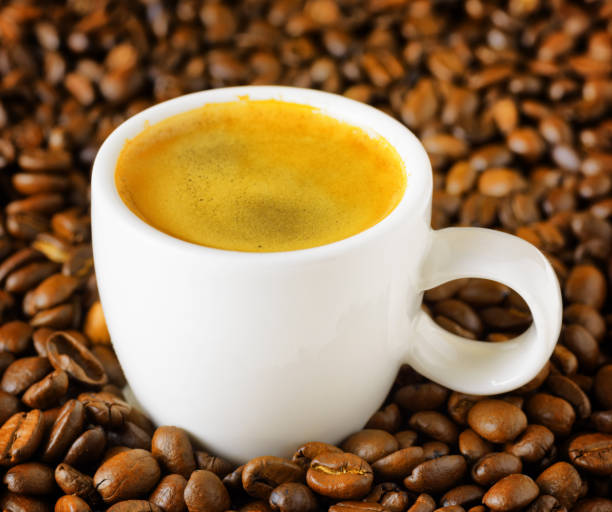 istock Cup of espresso in coffee beans 687917294
